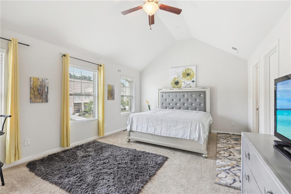 a bedroom with a large bed and a window