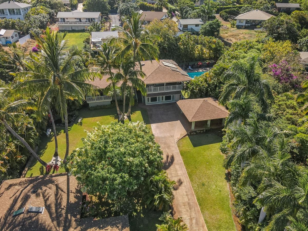 an aerial view of a house with a garden