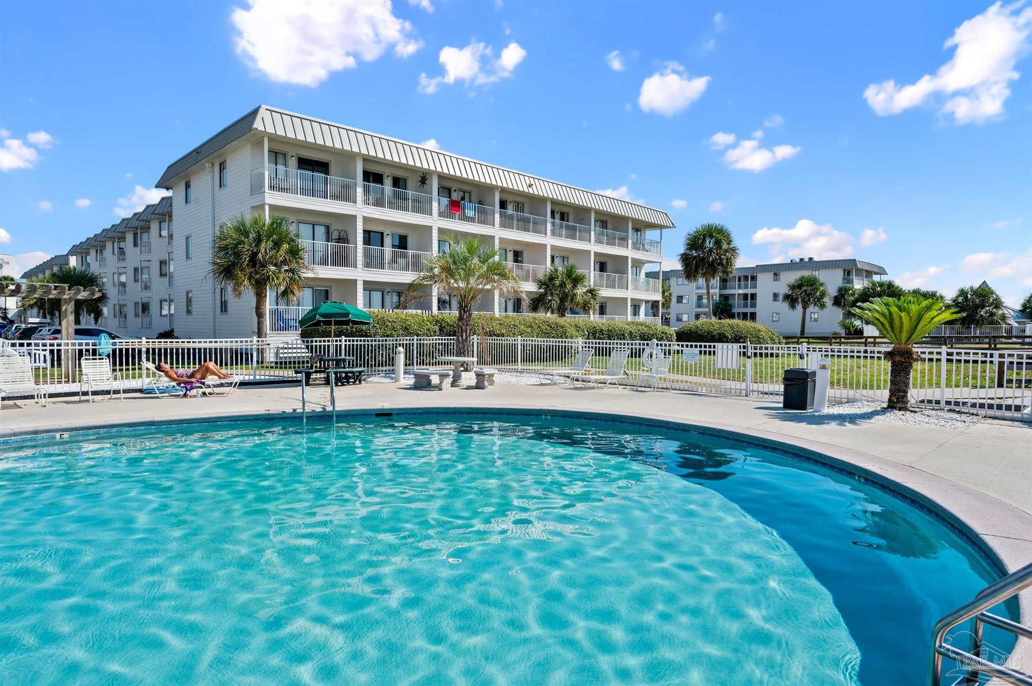 a view of a building with a swimming pool