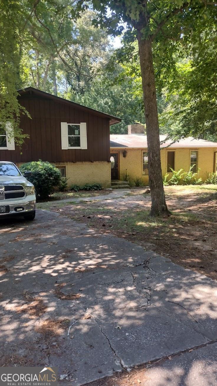 a view of a house with a tree