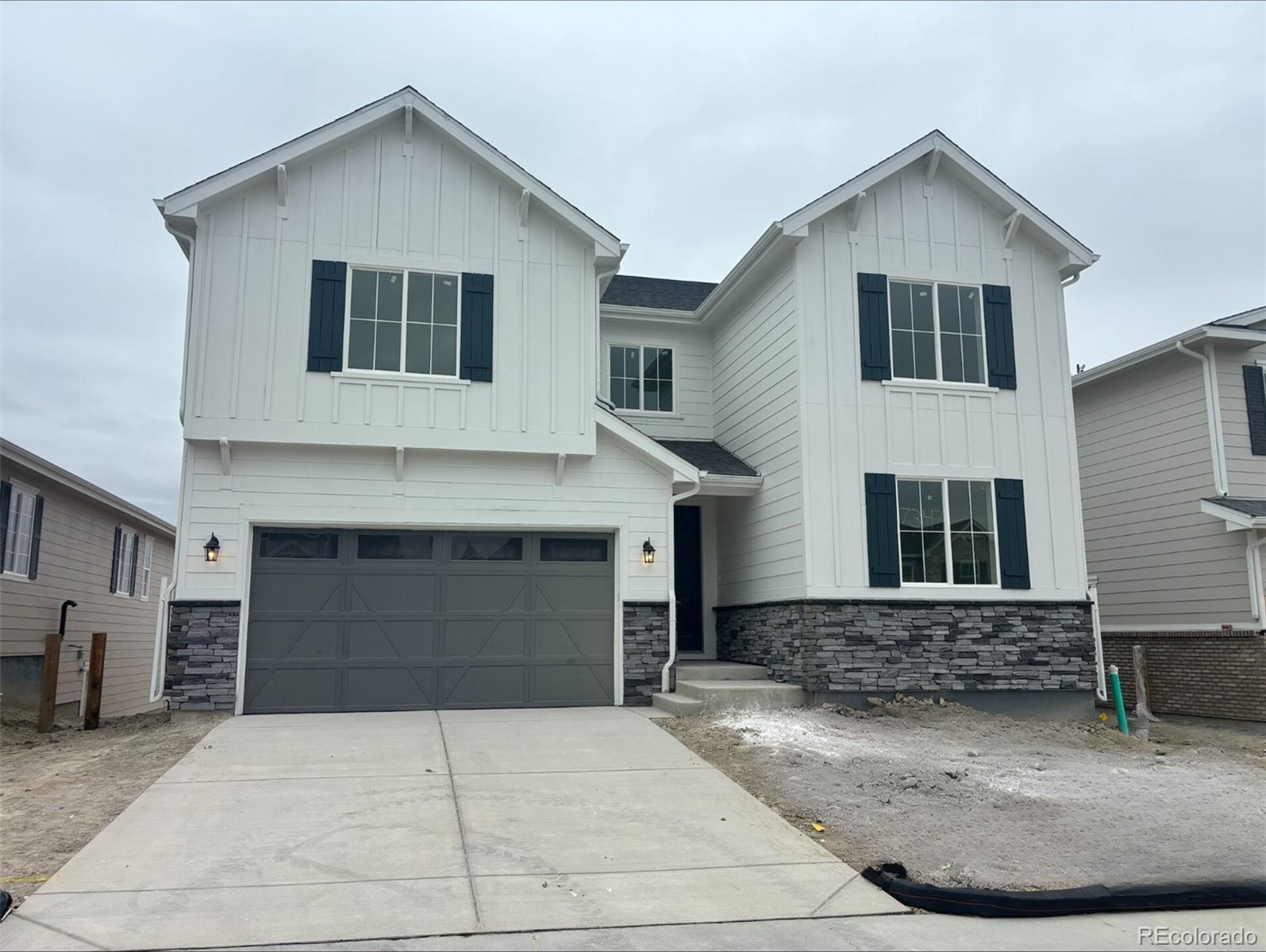 a front view of a house with garage