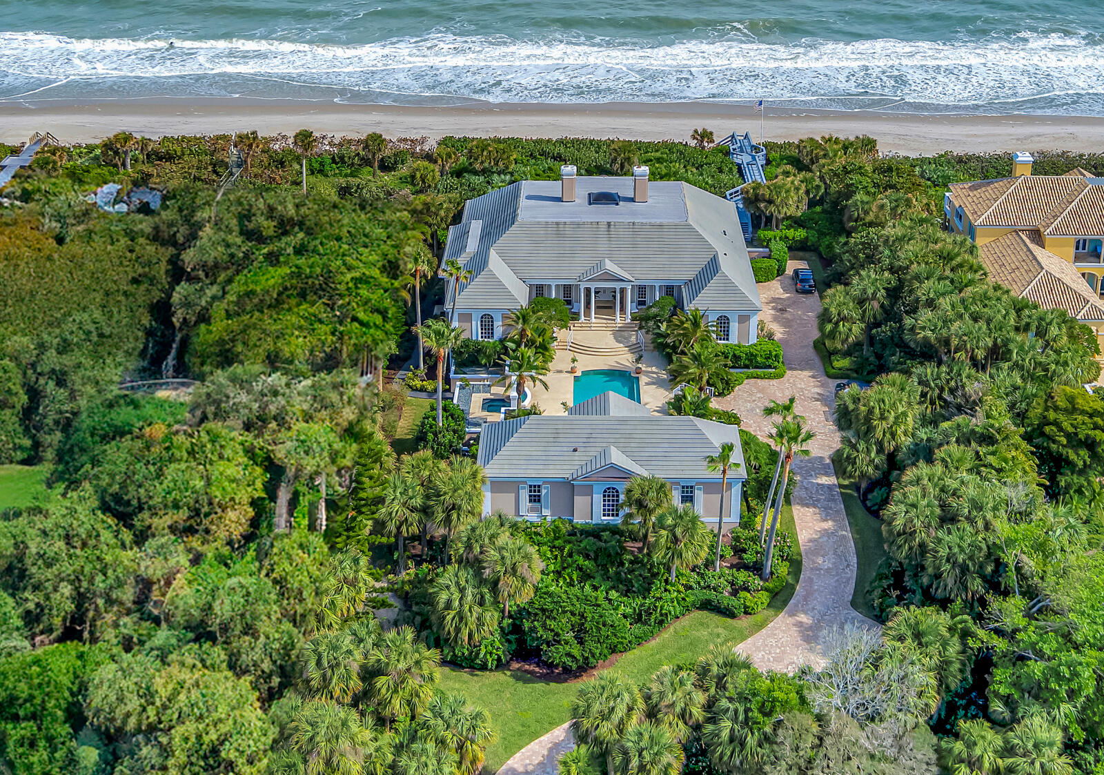 an aerial view of a house with a garden