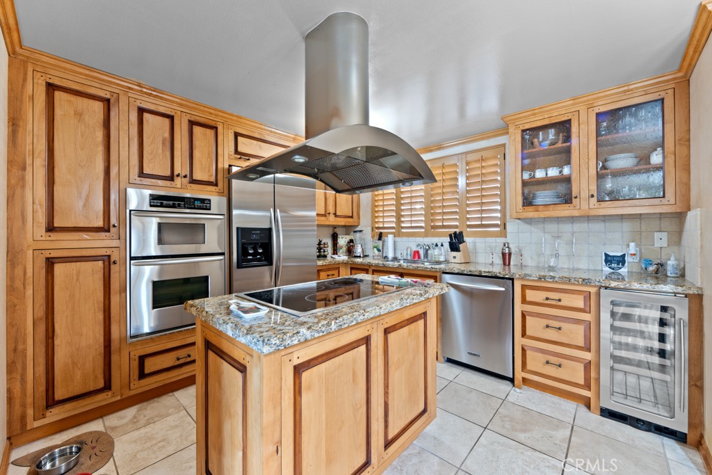 a kitchen with stainless steel appliances granite countertop a stove and a sink