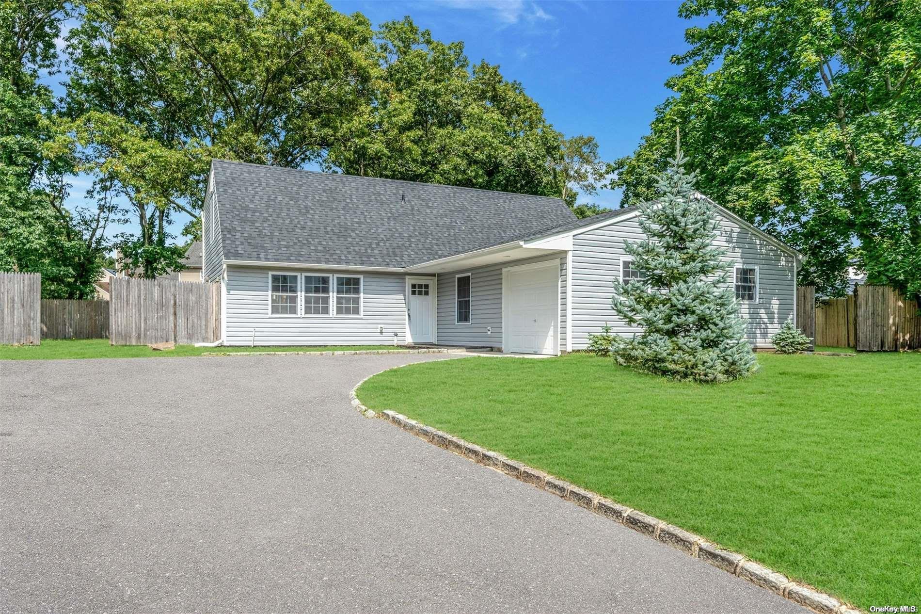 a house with a tree park in front of it