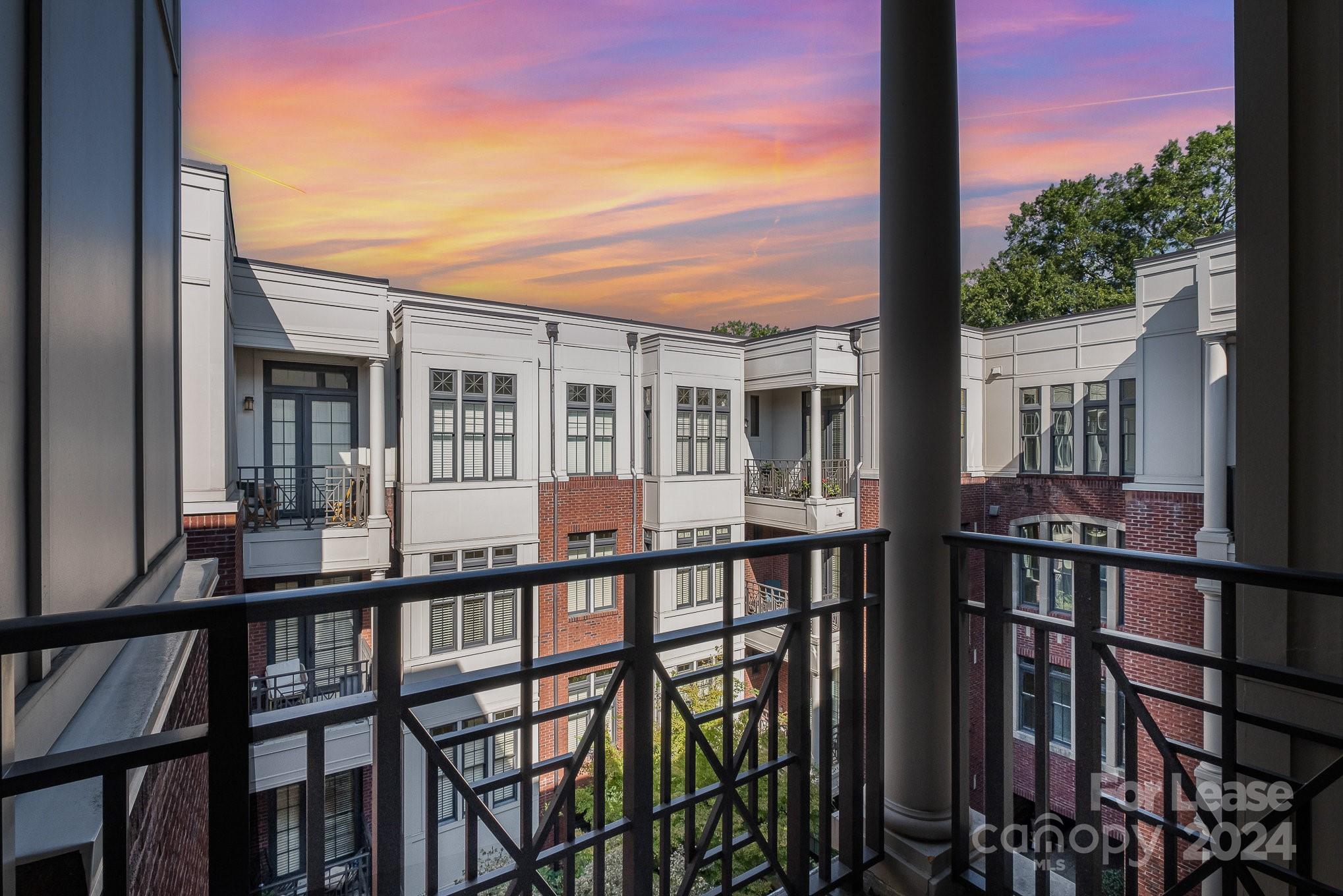 a view of a large brick building from a balcony