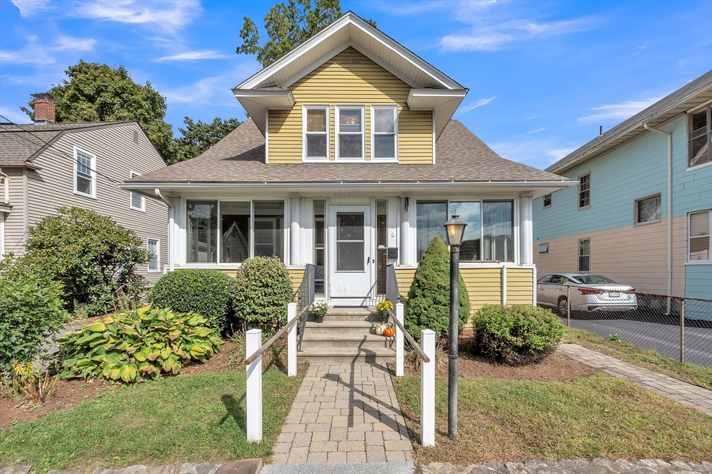 front view of a house with a yard