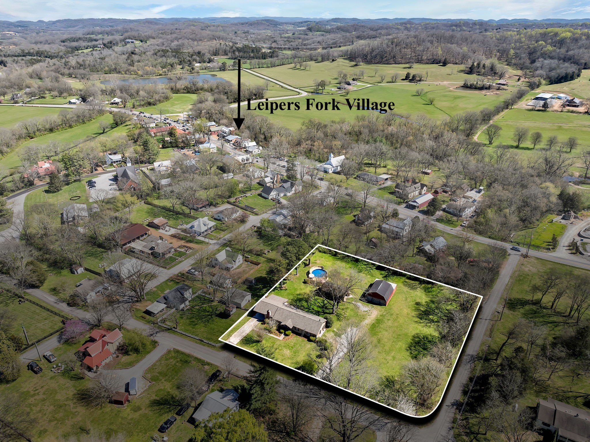 an aerial view of house with yard