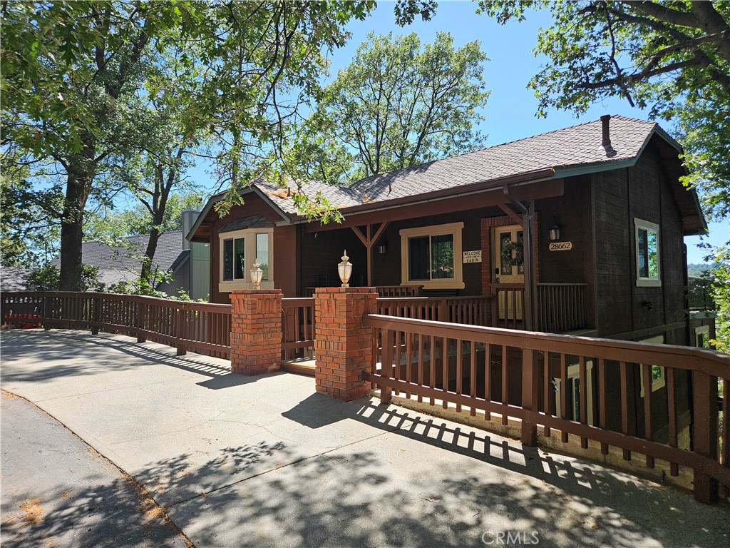 a view of a house with a wooden fence