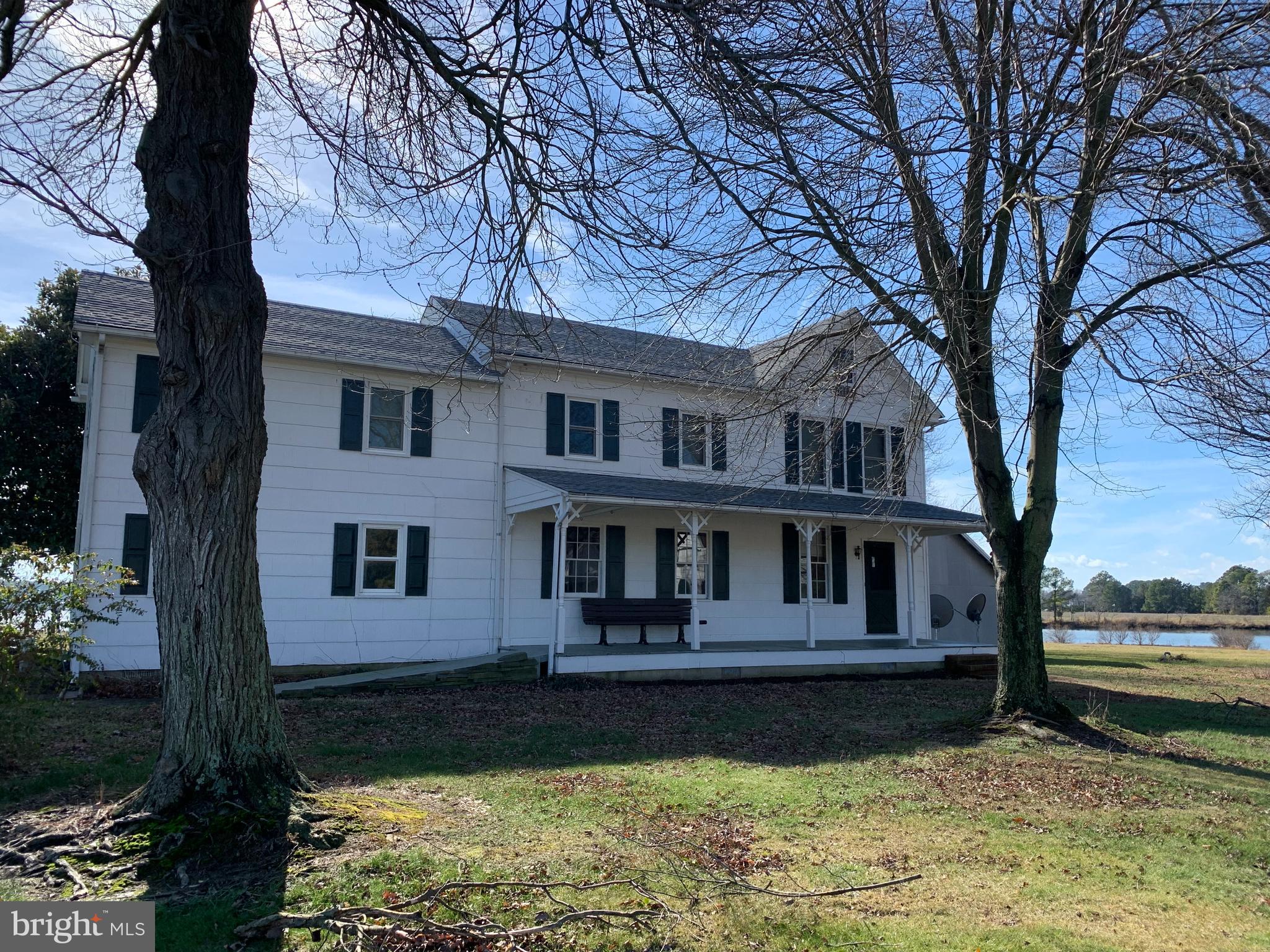 a house that has a tree in front of it