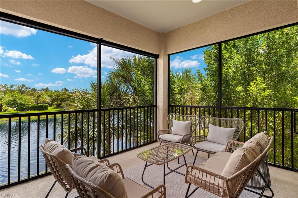 a view of a chair and table in the balcony