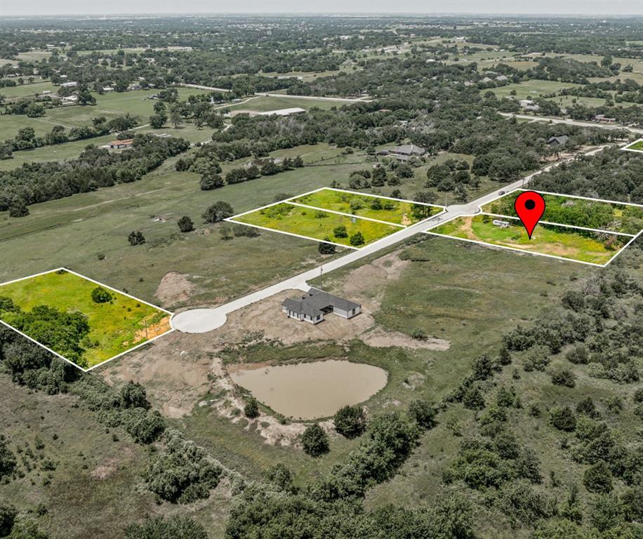 an aerial view of a house with a swimming pool