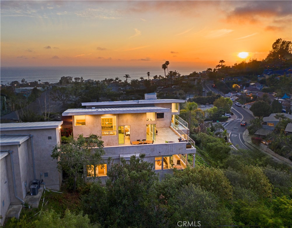 an aerial view of house with outdoor space swimming pool and mountains