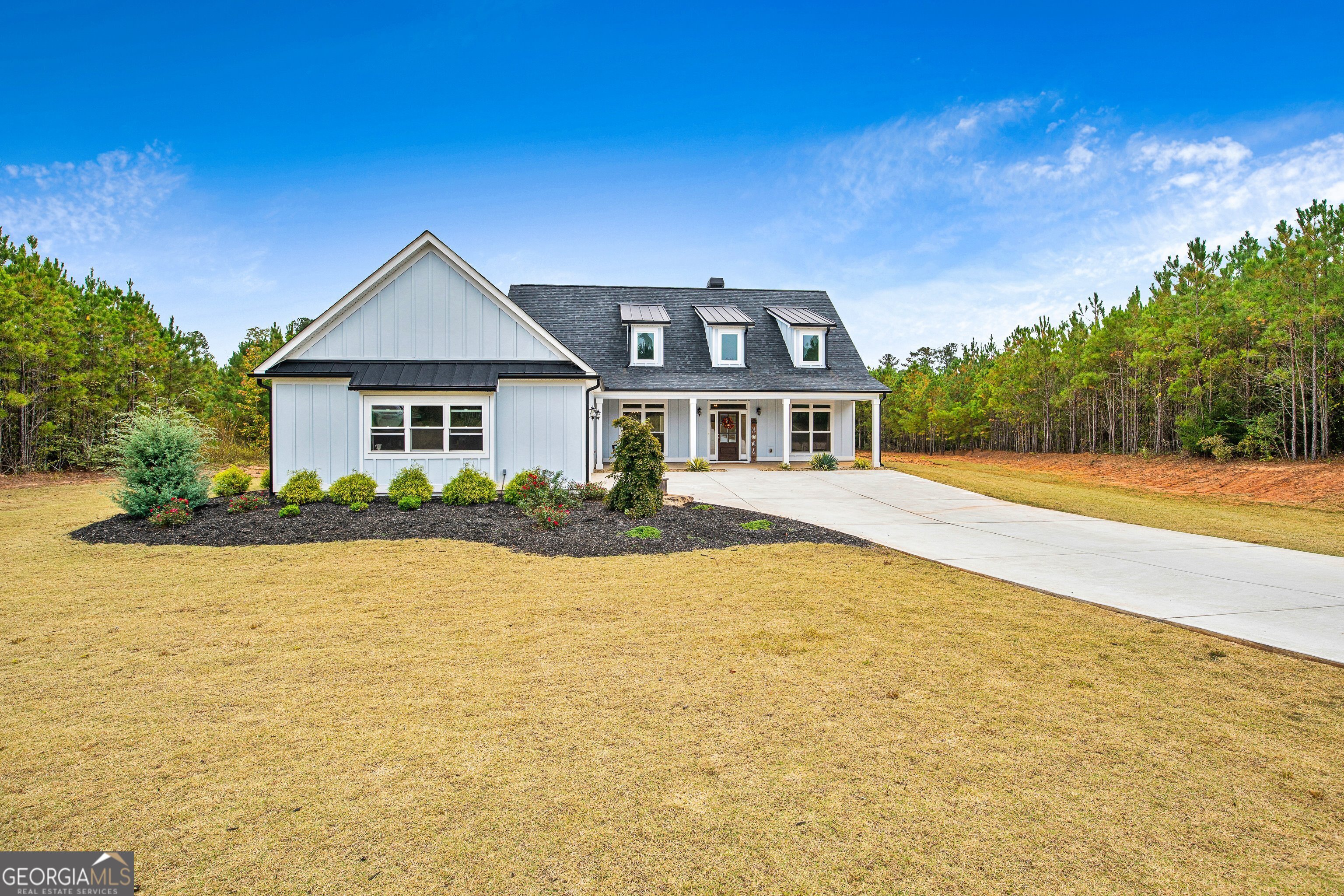 a front view of a house with a yard