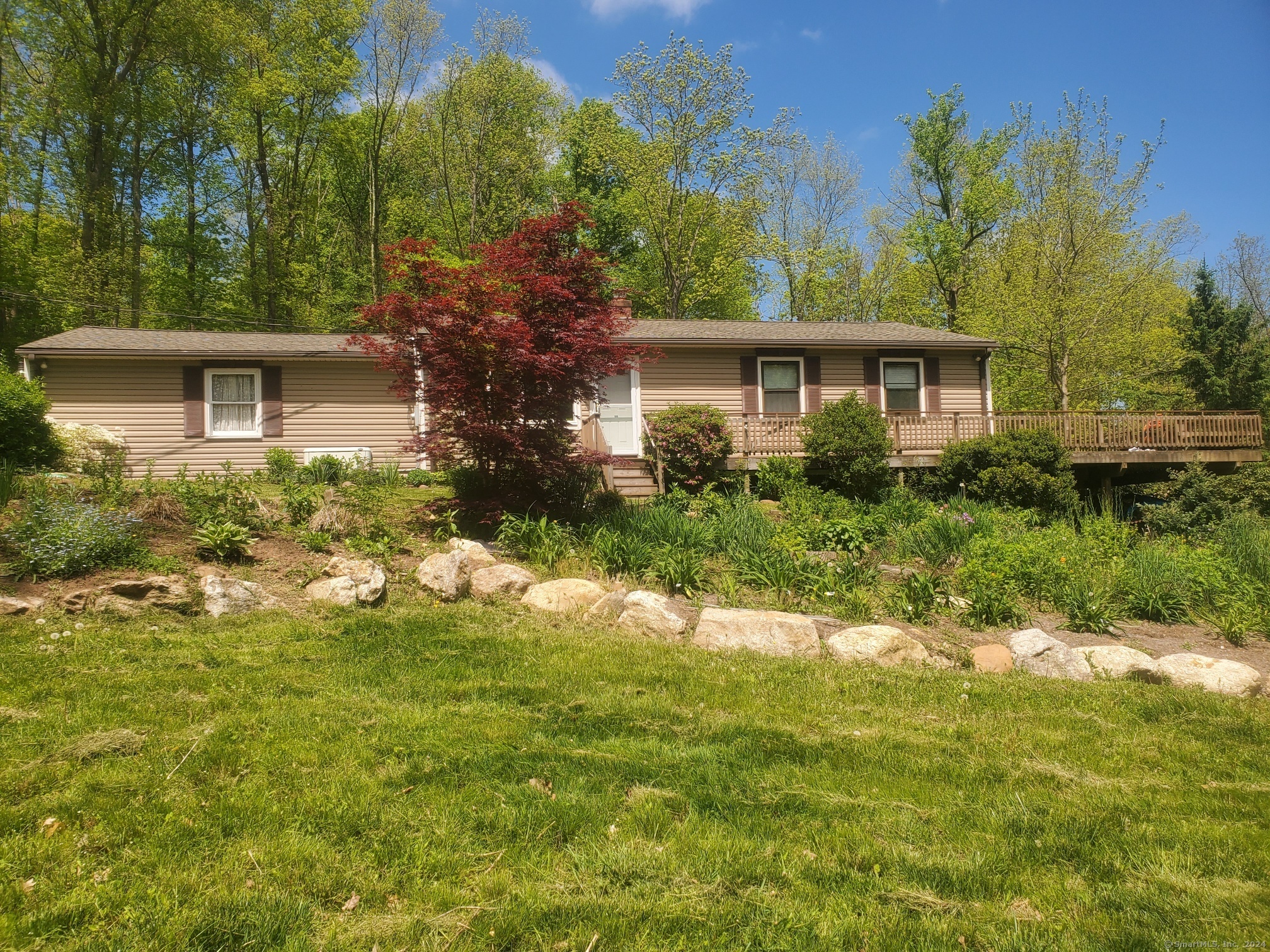 front view of a house with a yard