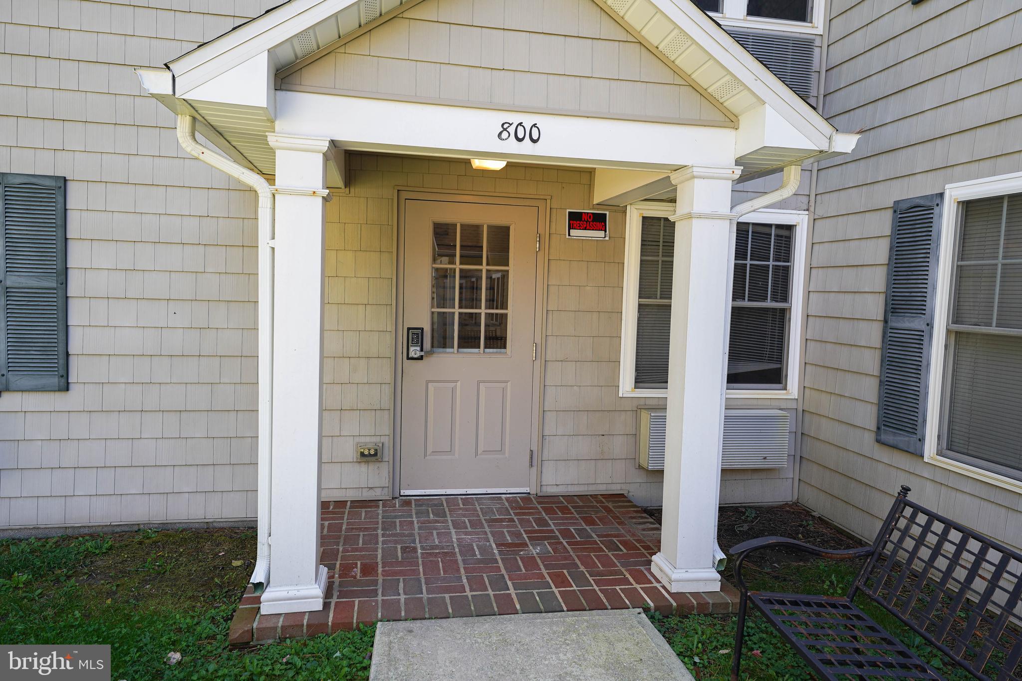 a front view of a house with a glass door