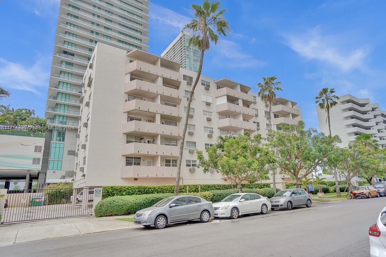 a cars parked in front of a building