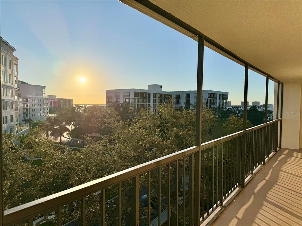 a view of a balcony with city view