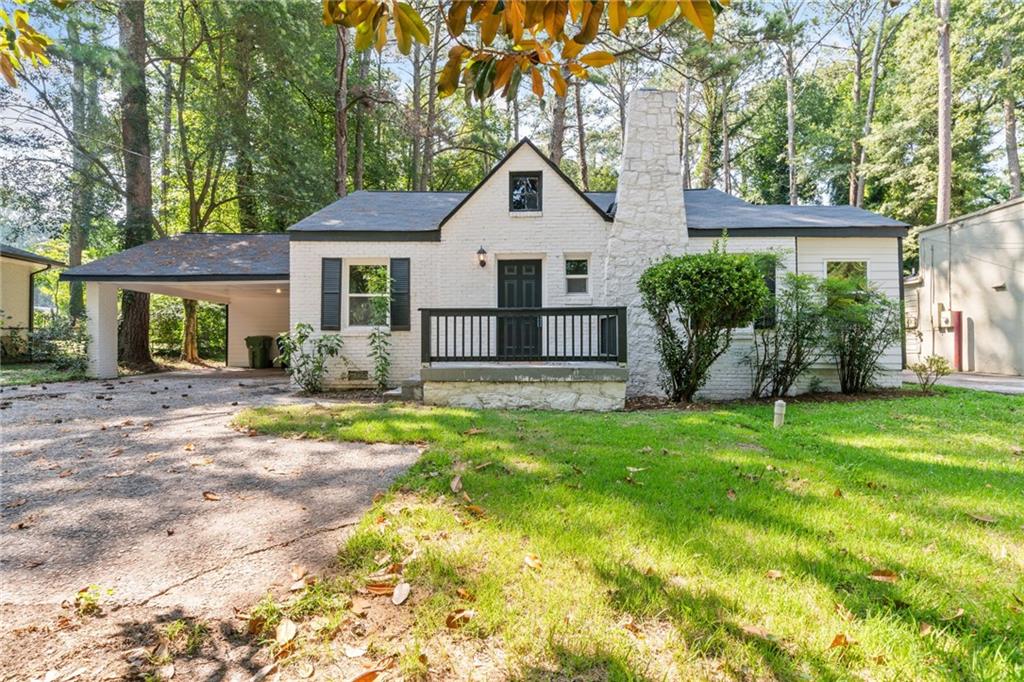 a front view of a house with a yard and porch