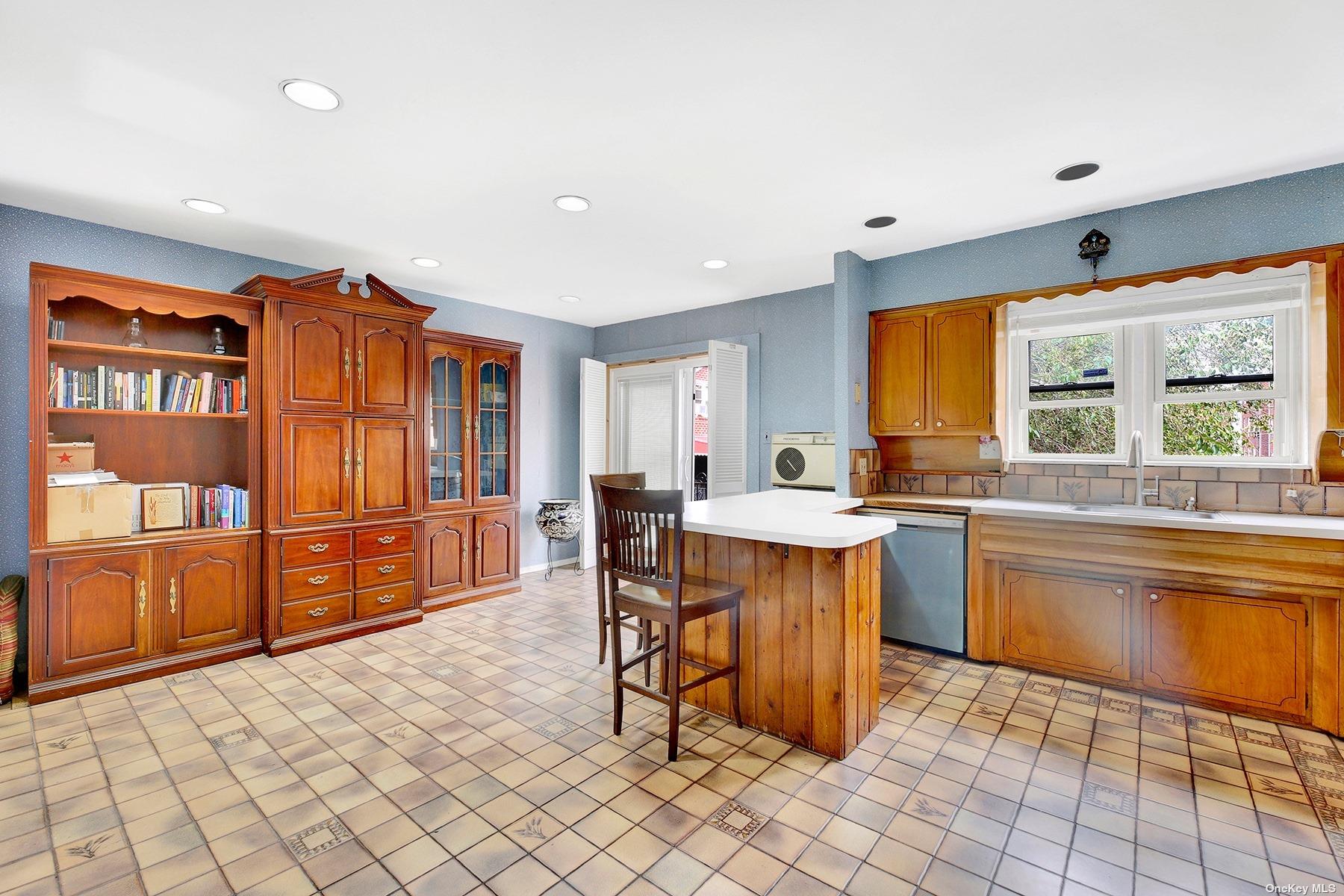 a kitchen with stainless steel appliances granite countertop a refrigerator and wooden cabinets