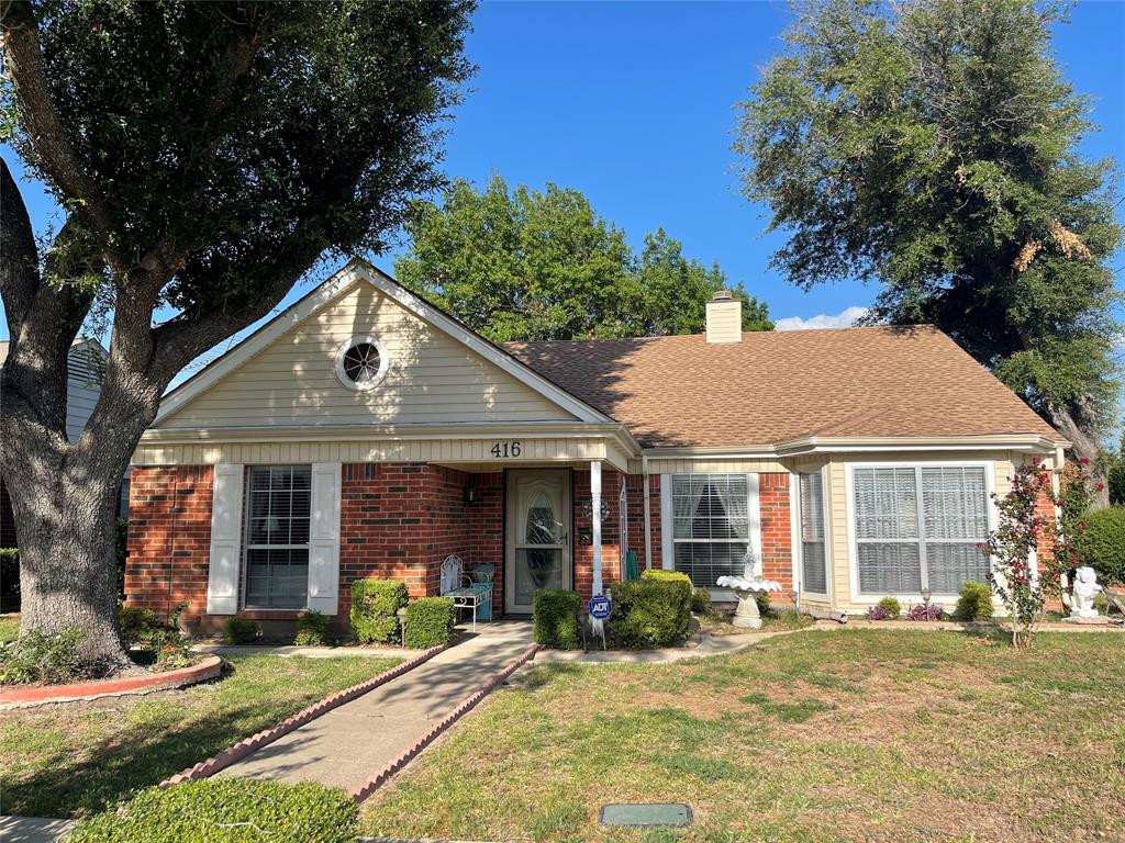 front view of a house with a yard