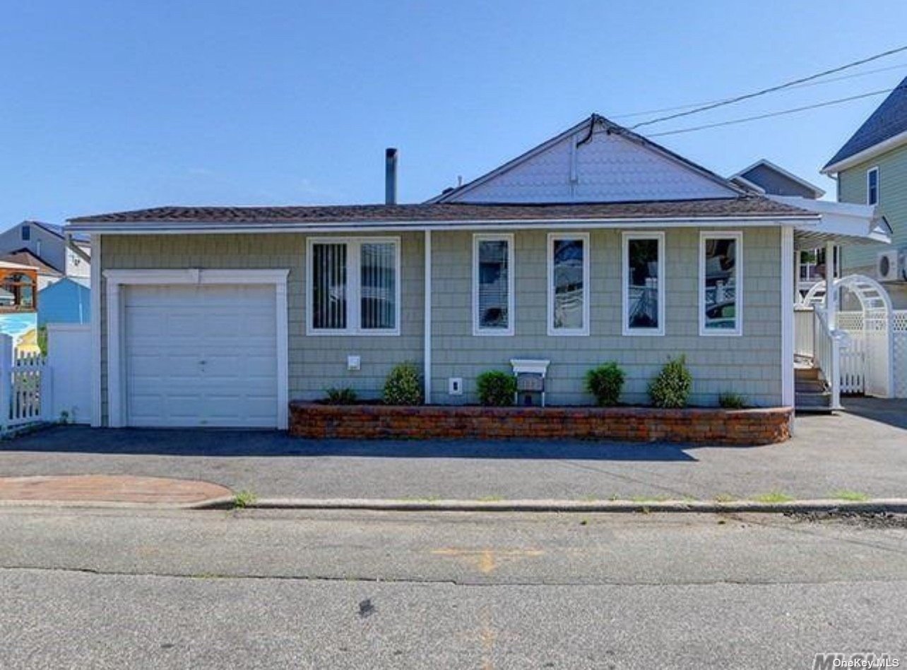 front view of a house with a small yard