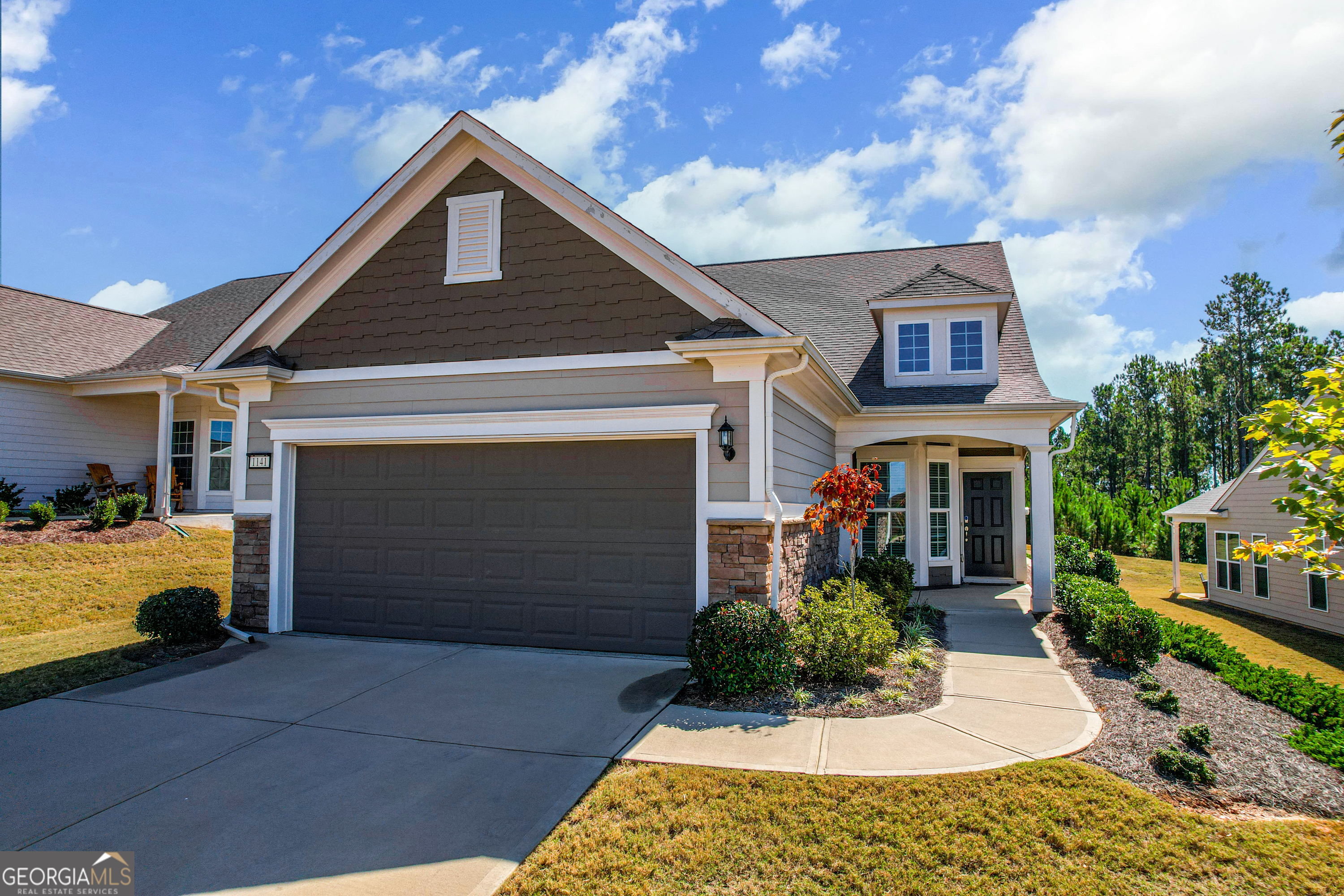 a front view of a house with a yard