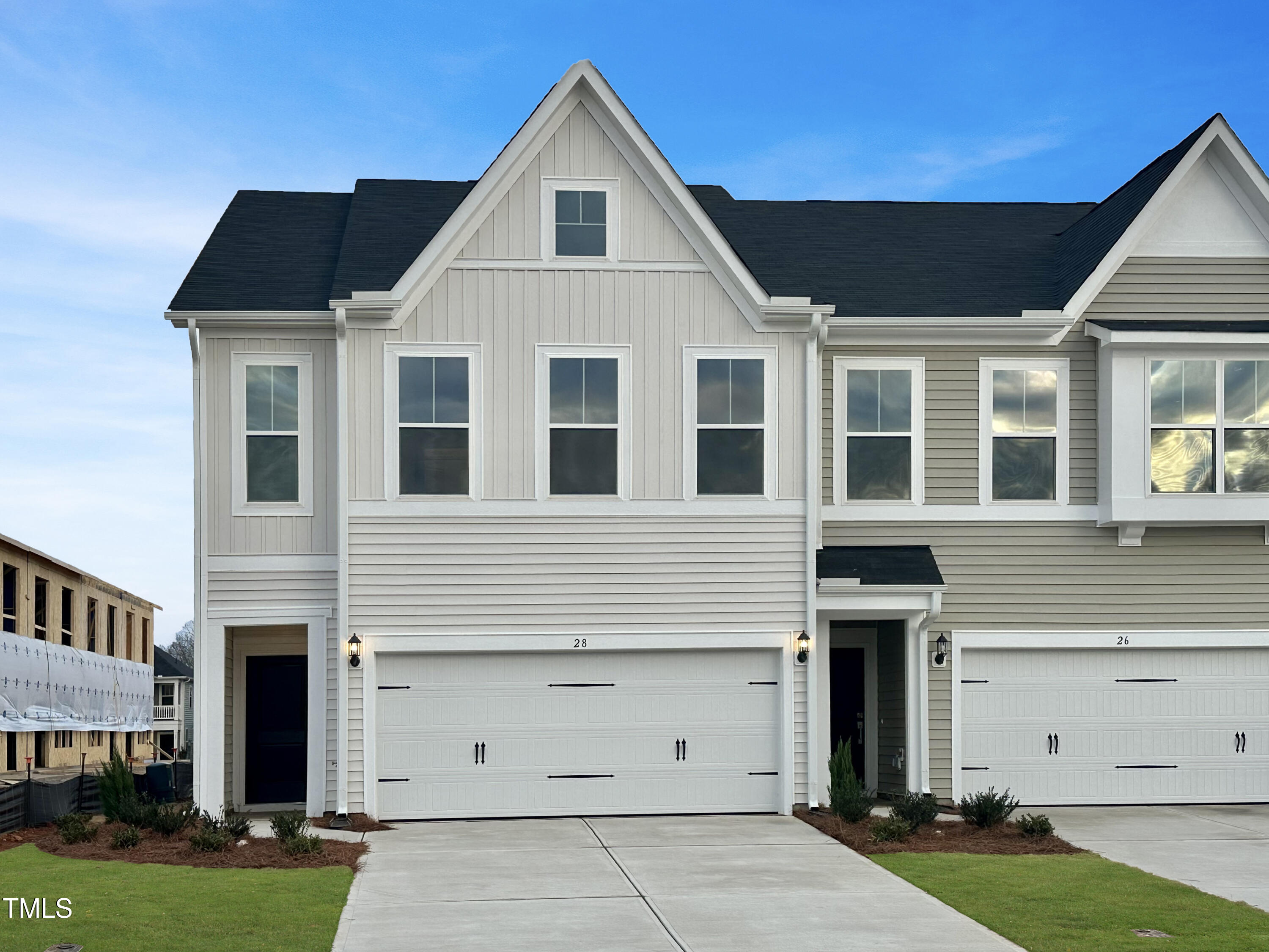 a front view of a house with a garage