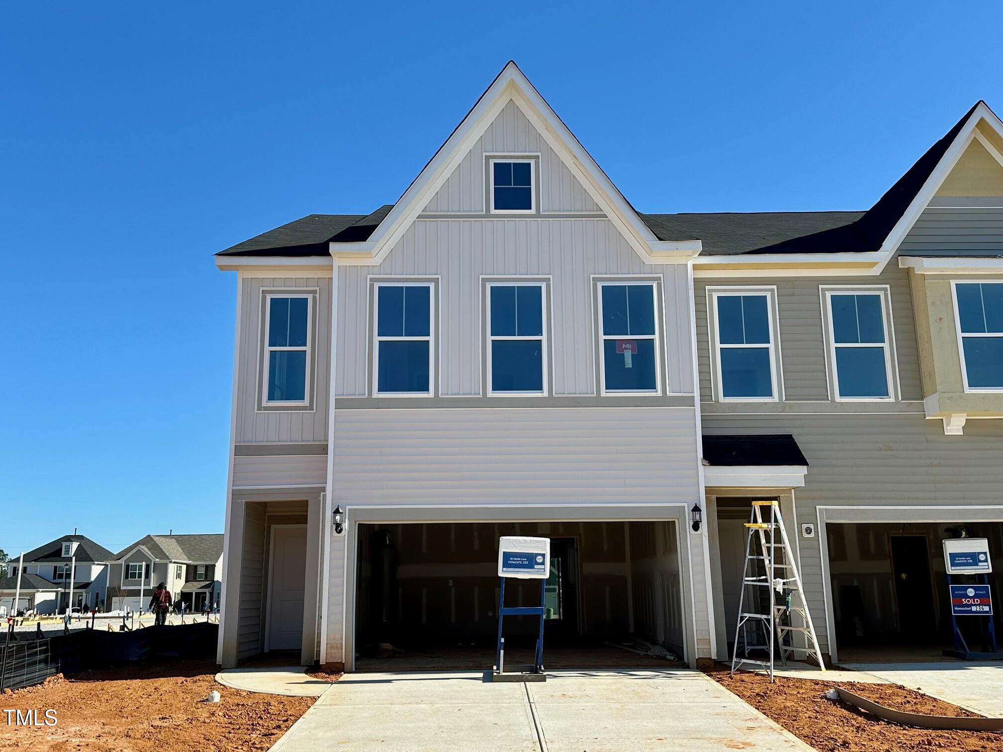 a front view of a house with yard