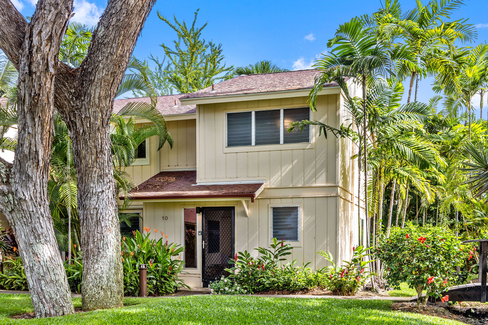 a front view of a house with a yard