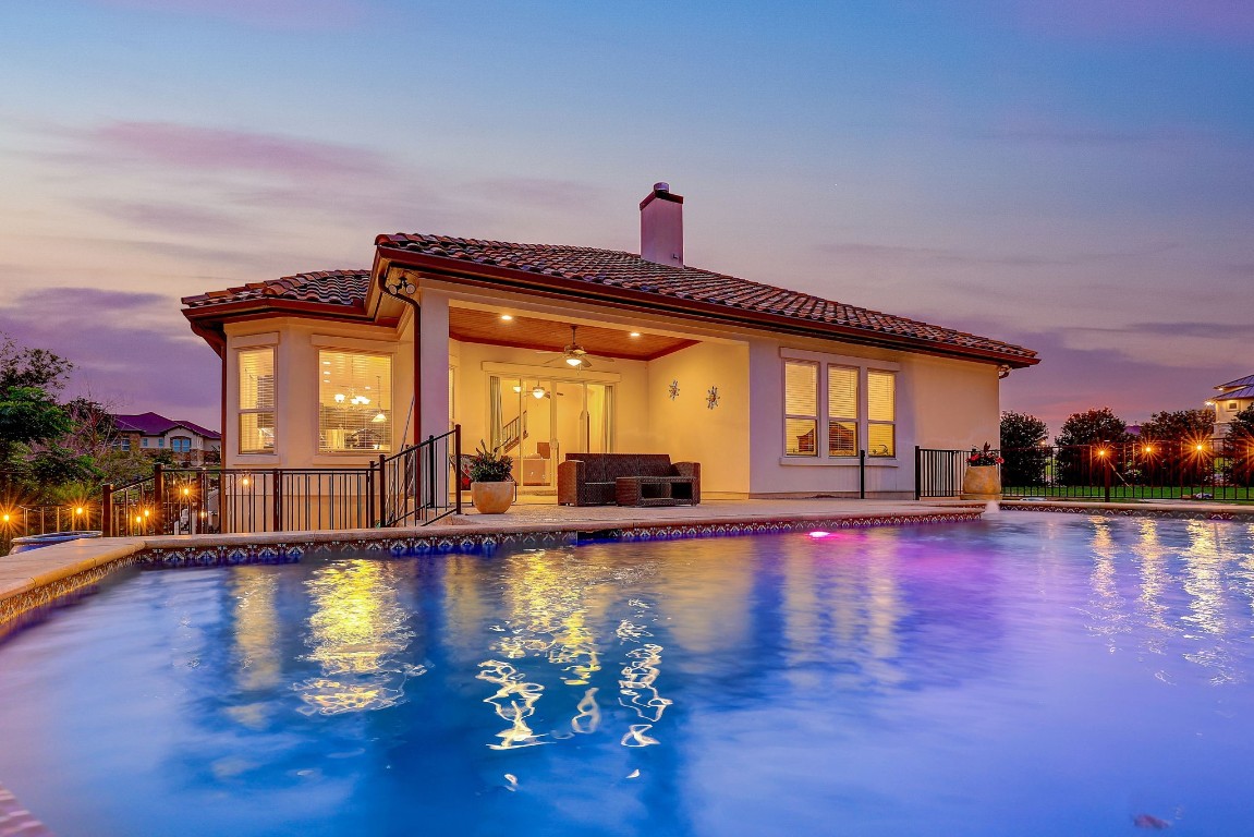 a view of a swimming pool with an outdoor seating