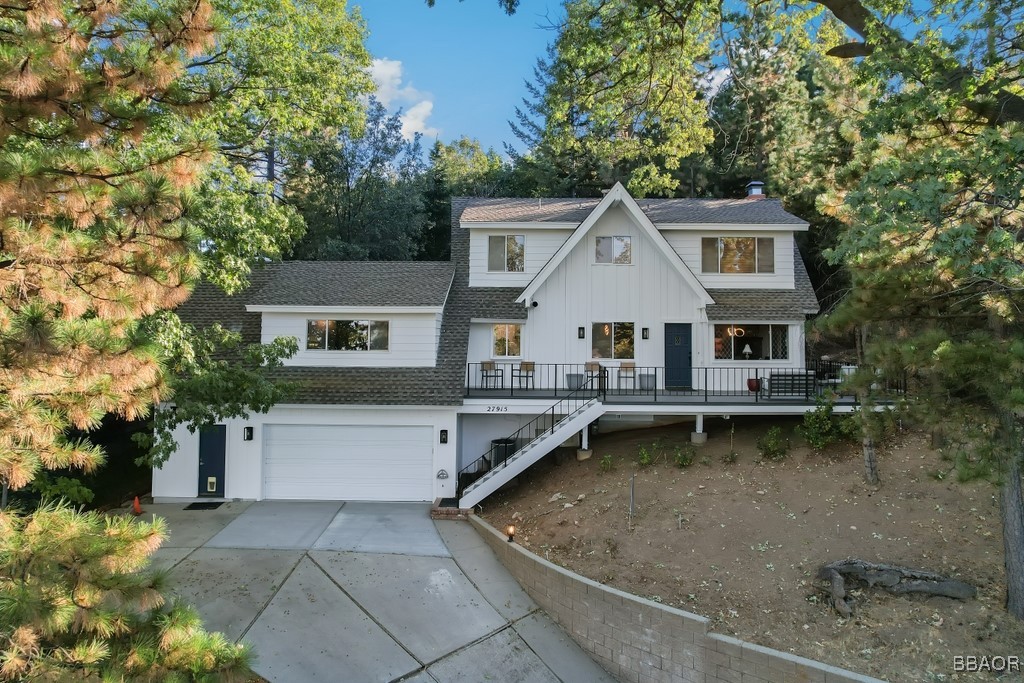 a view of a house with pool table and chairs