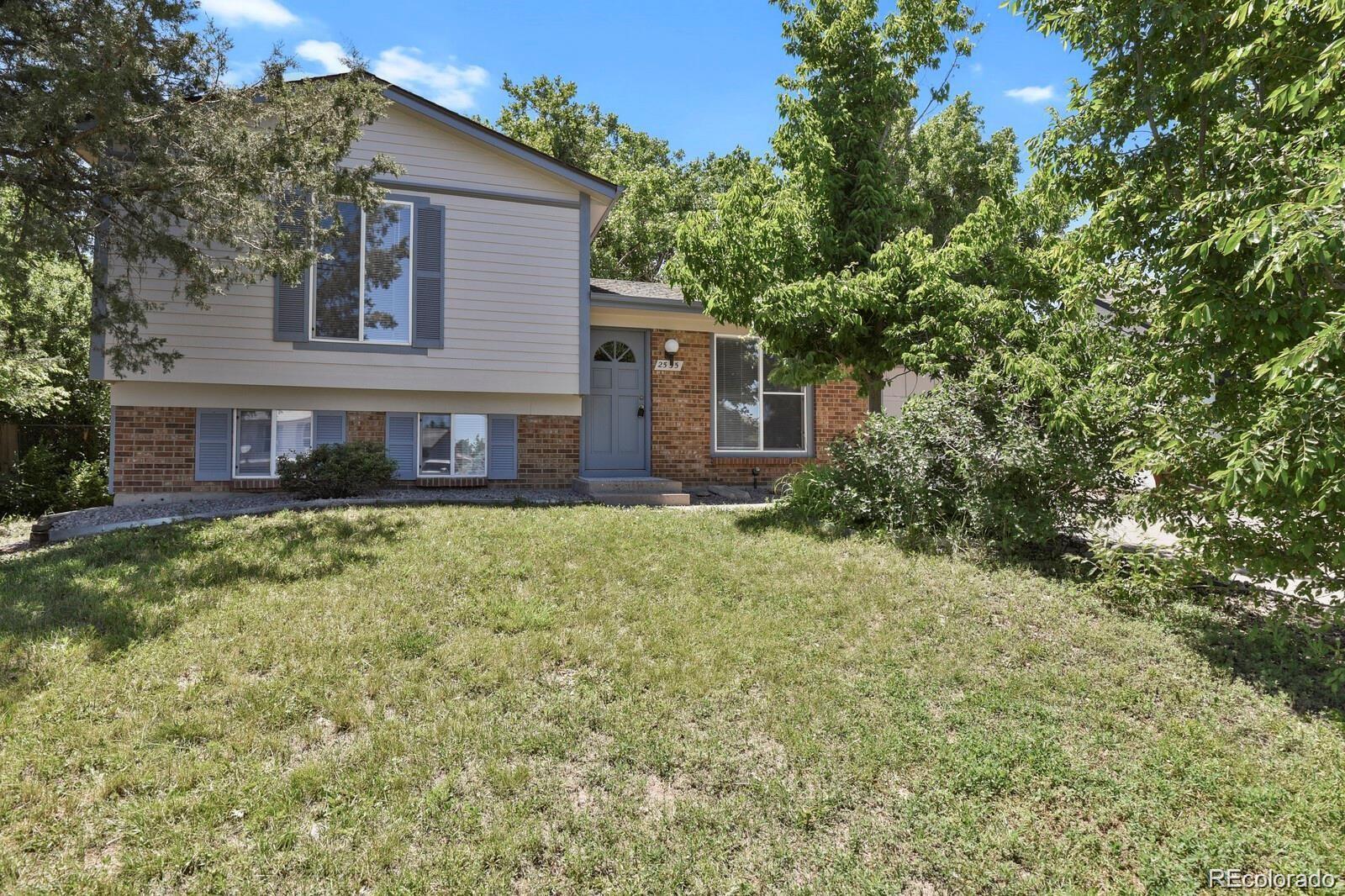 front view of a house with a yard