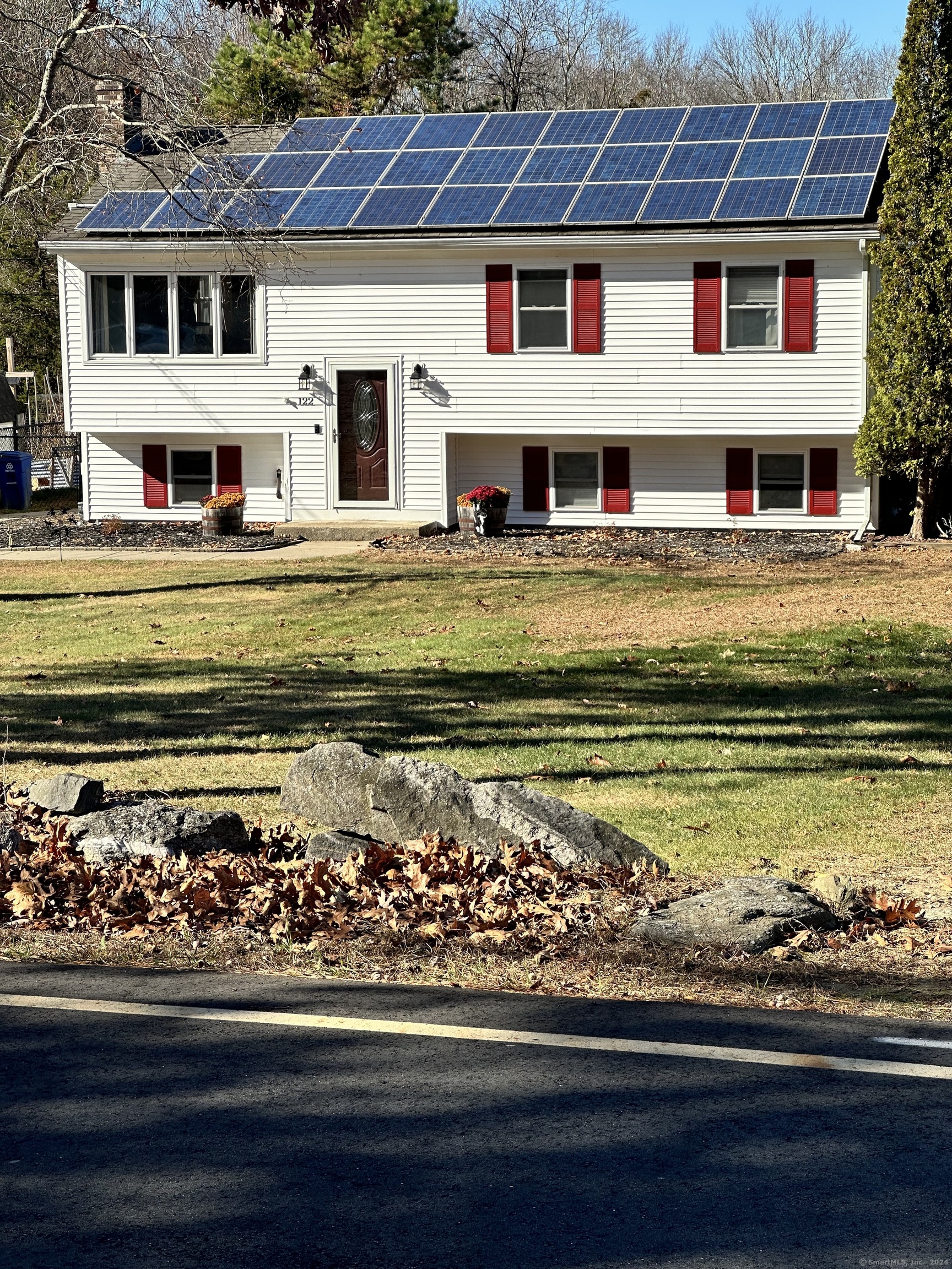 a front view of a house with a big yard