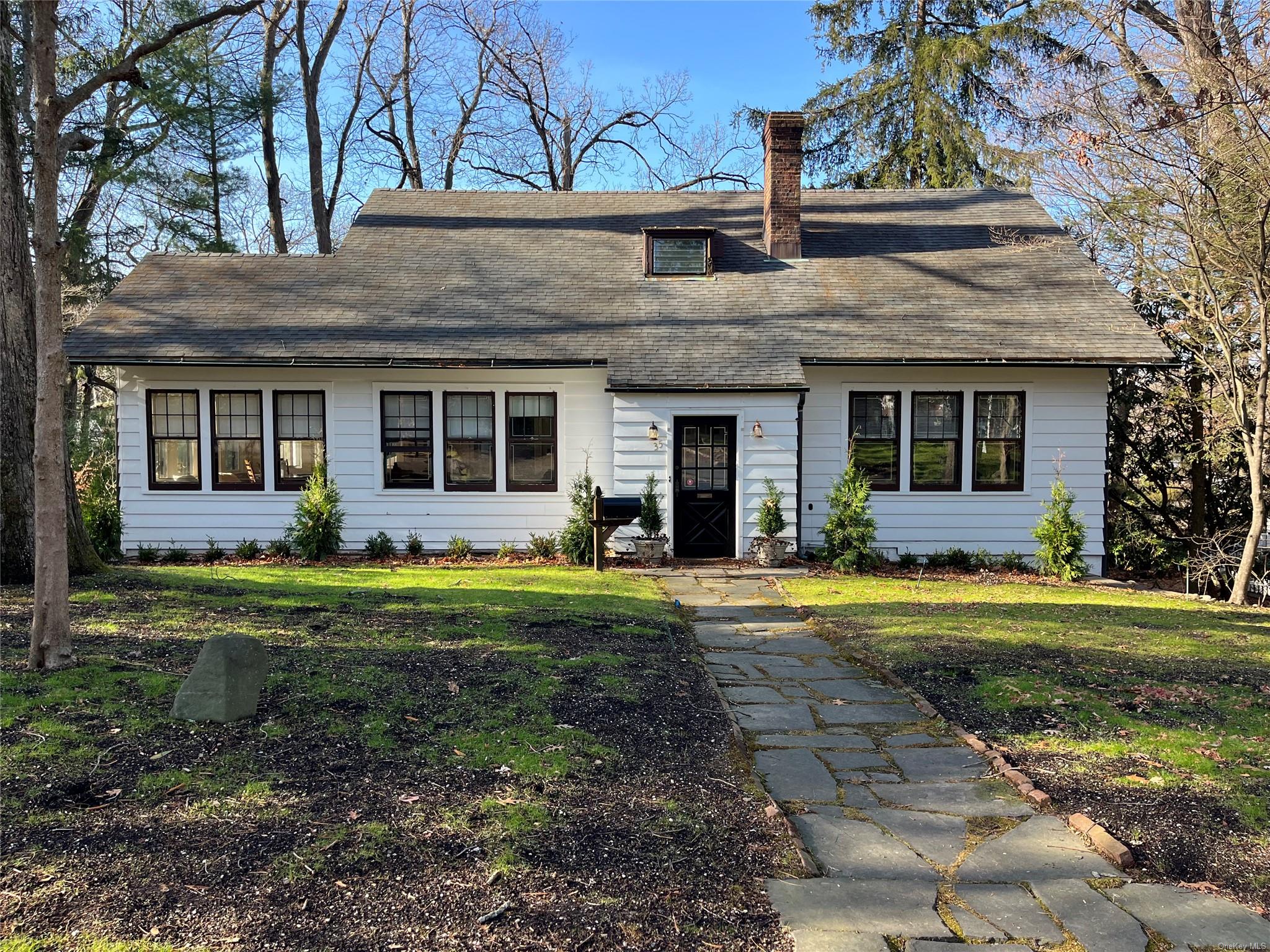 View of front of property with a front lawn