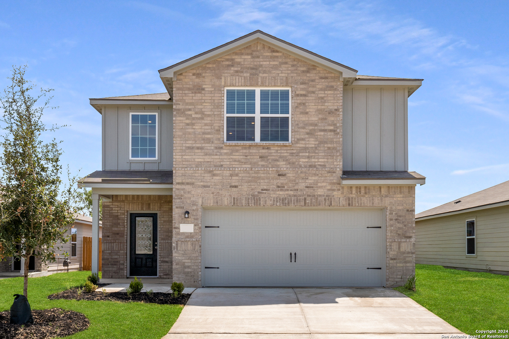 front view of a house with a yard