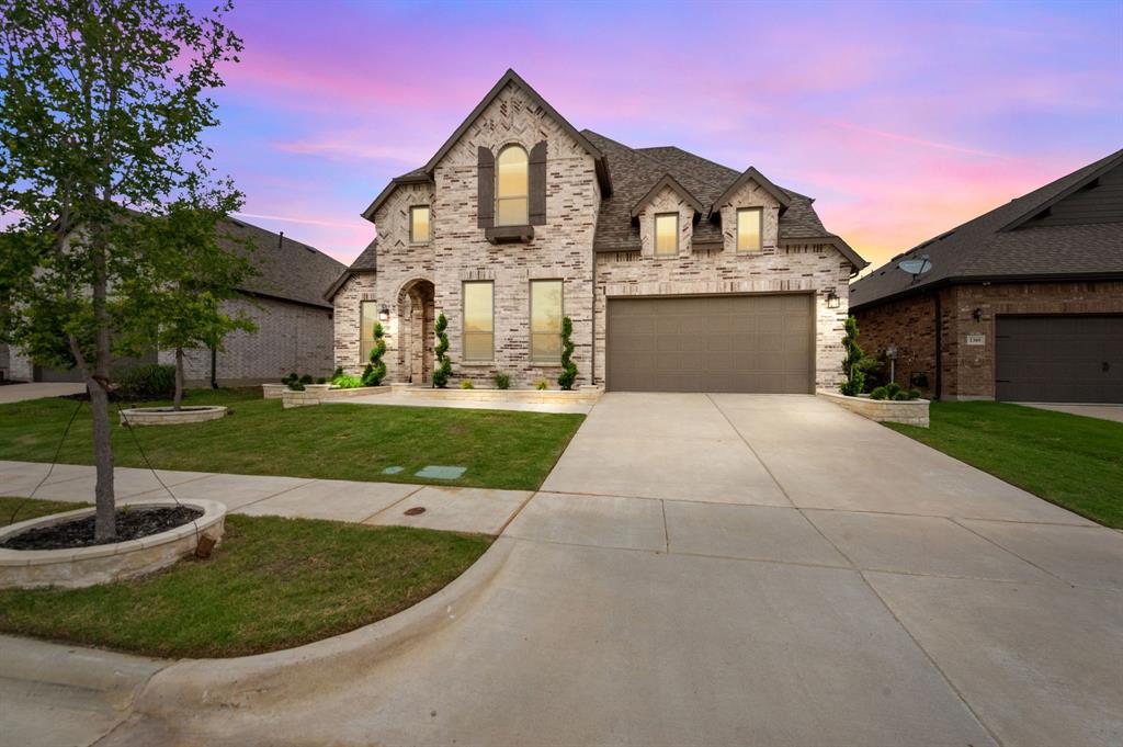 a front view of a house with yard