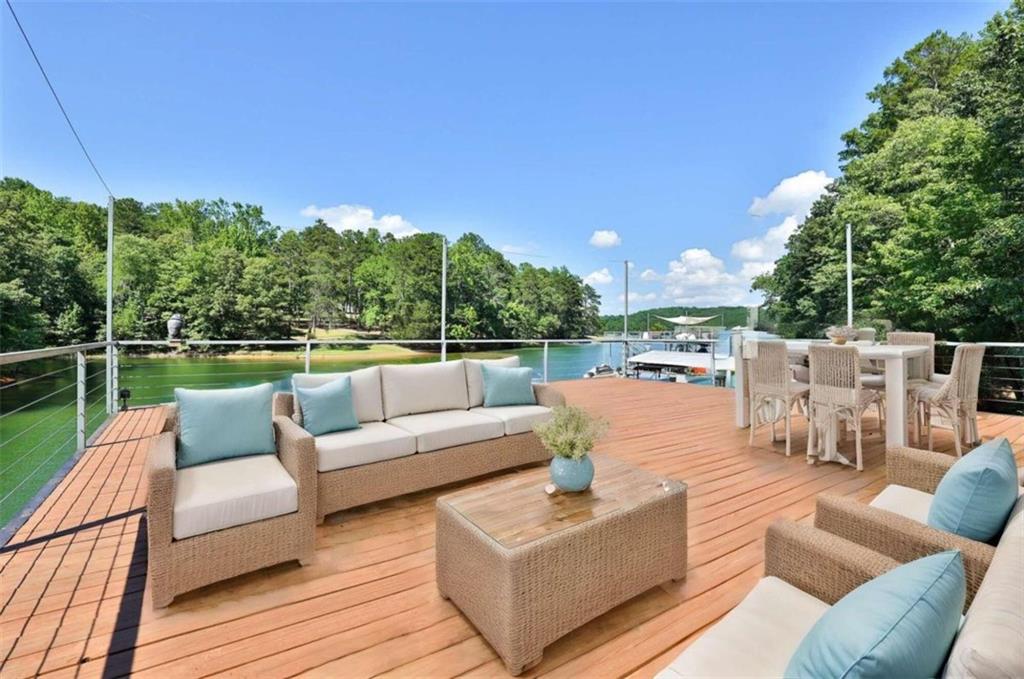 a view of a terrace with couches and pool