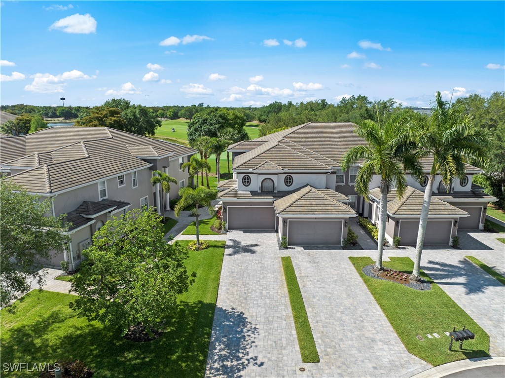 an aerial view of a house with a garden and plants