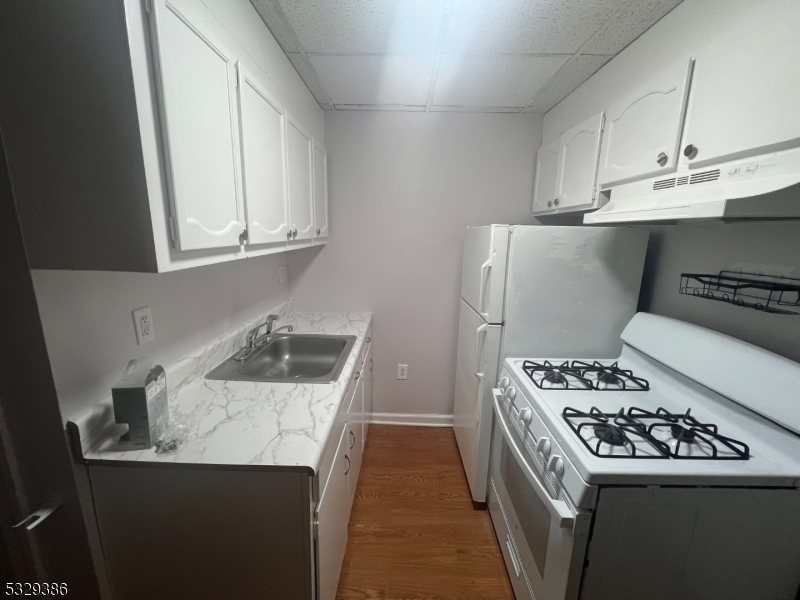 a kitchen with a stove and a sink