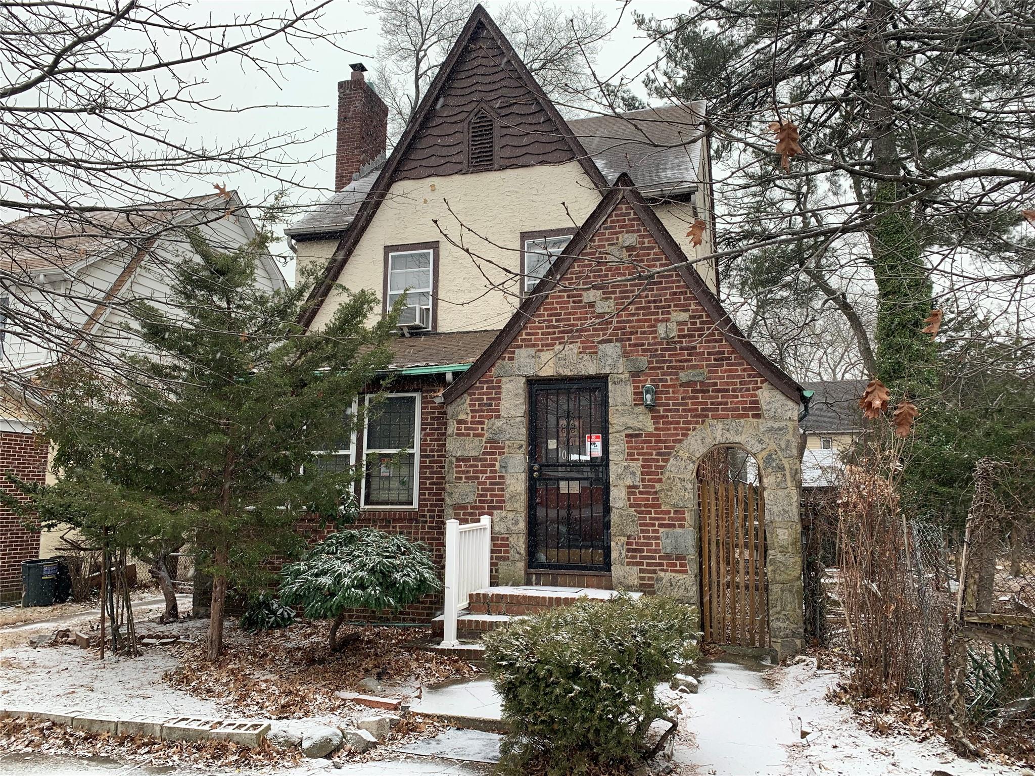 View of english style home