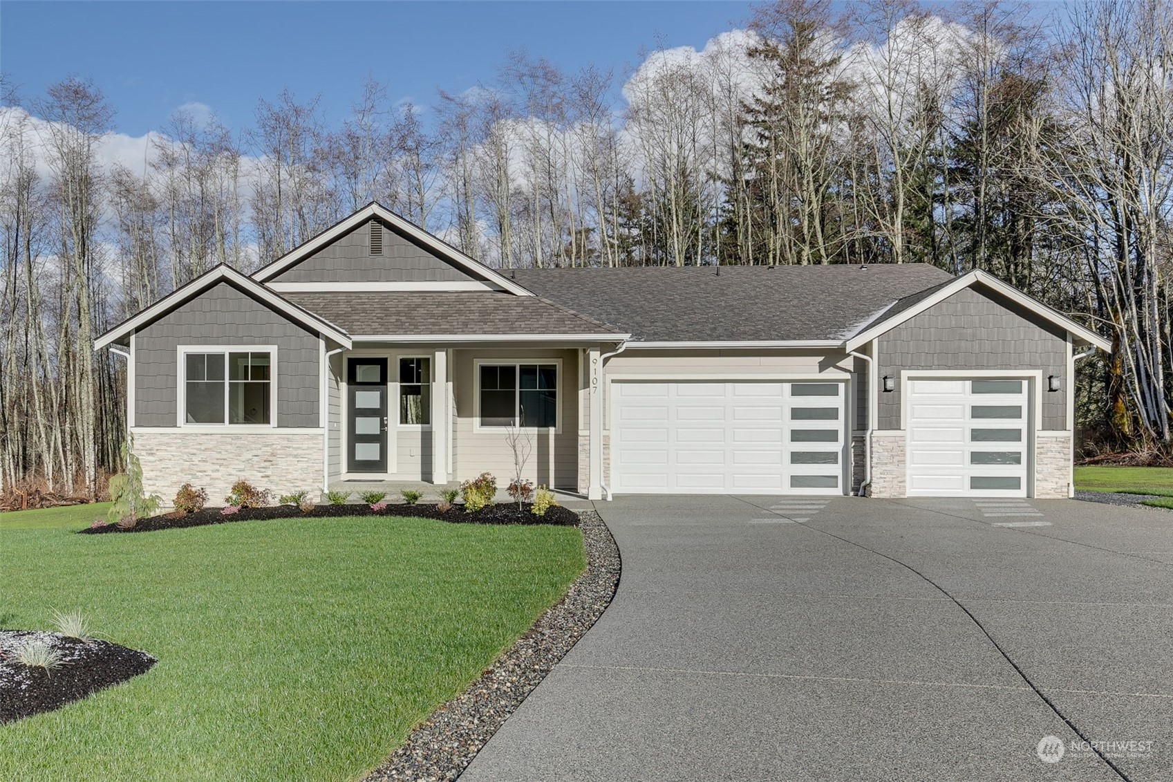 a front view of a house with a yard