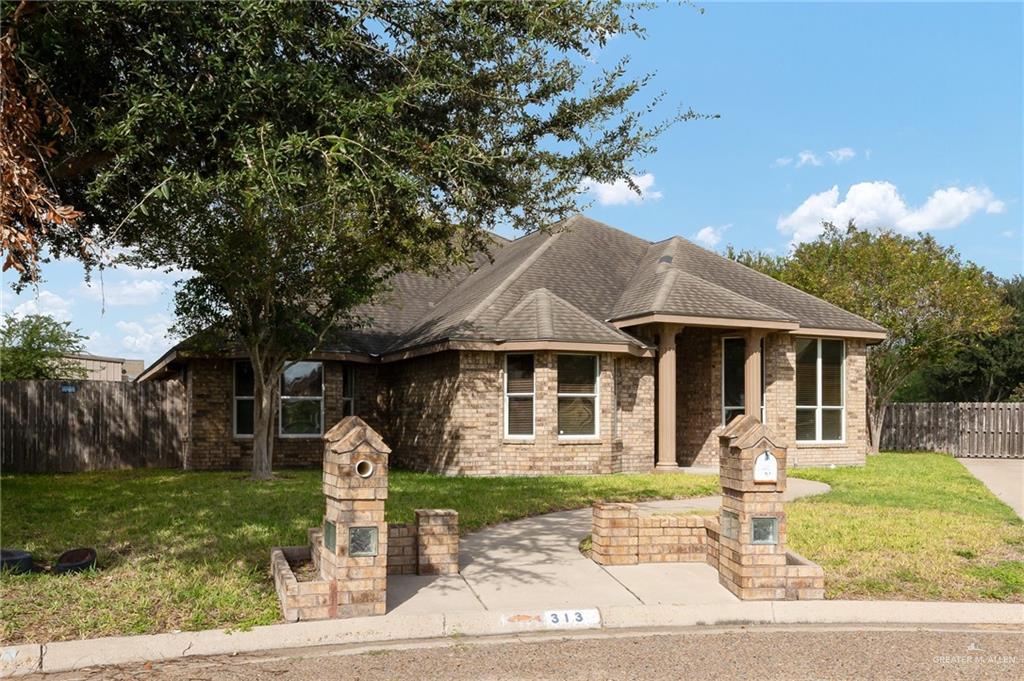 View of front facade featuring a patio area and a front lawn