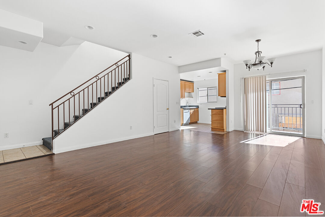 a view of an entryway with wooden floor