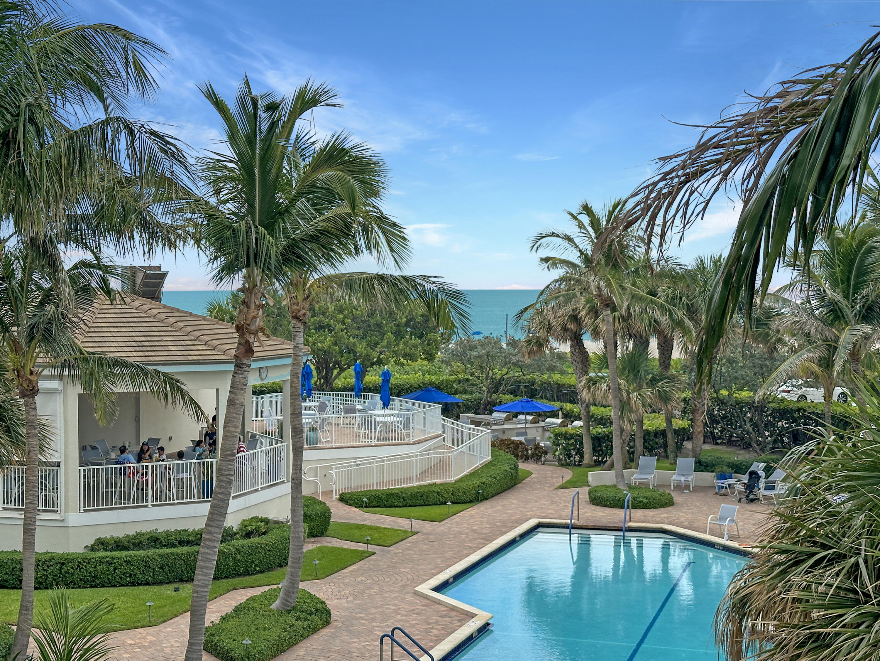 a swimming pool with outdoor seating and yard