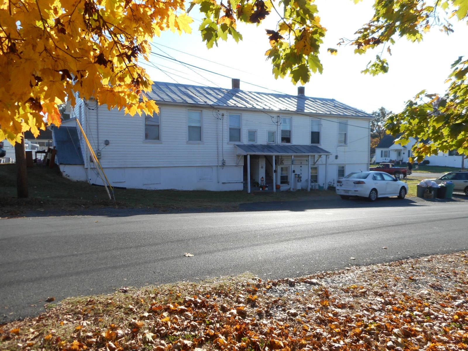 a view of a house with a street