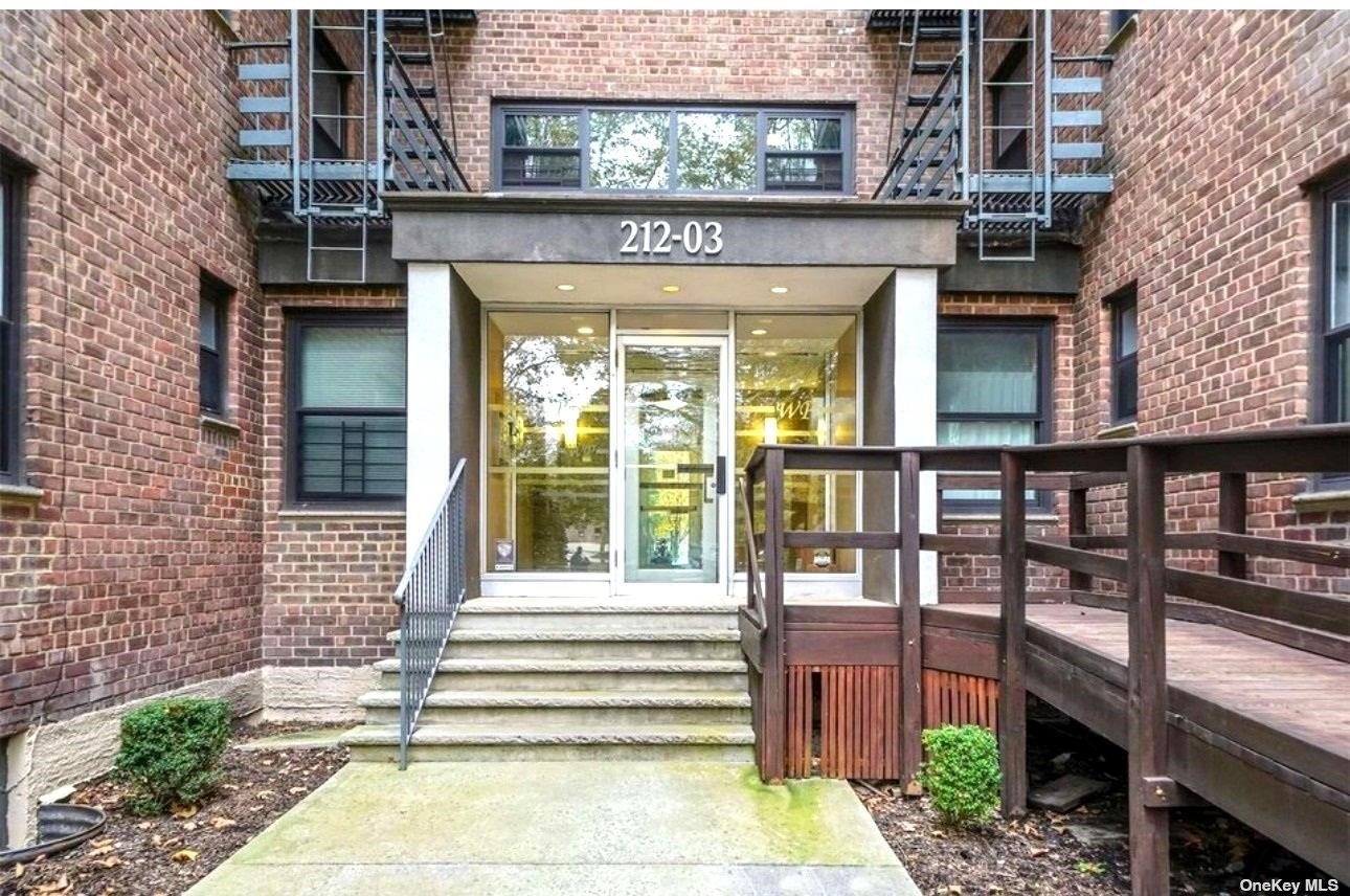 a front view of a building with a porch