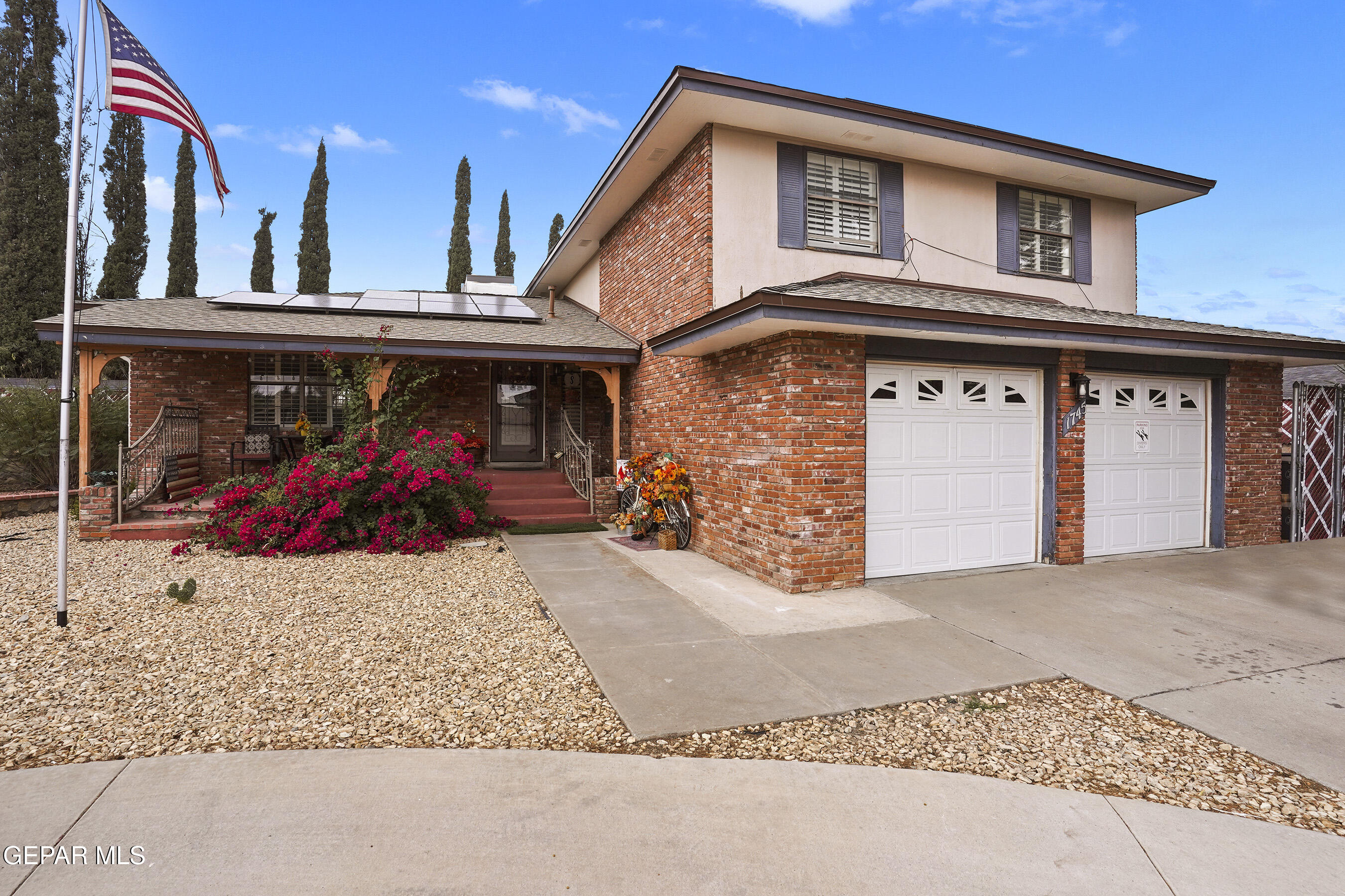 a front view of a house with a garage