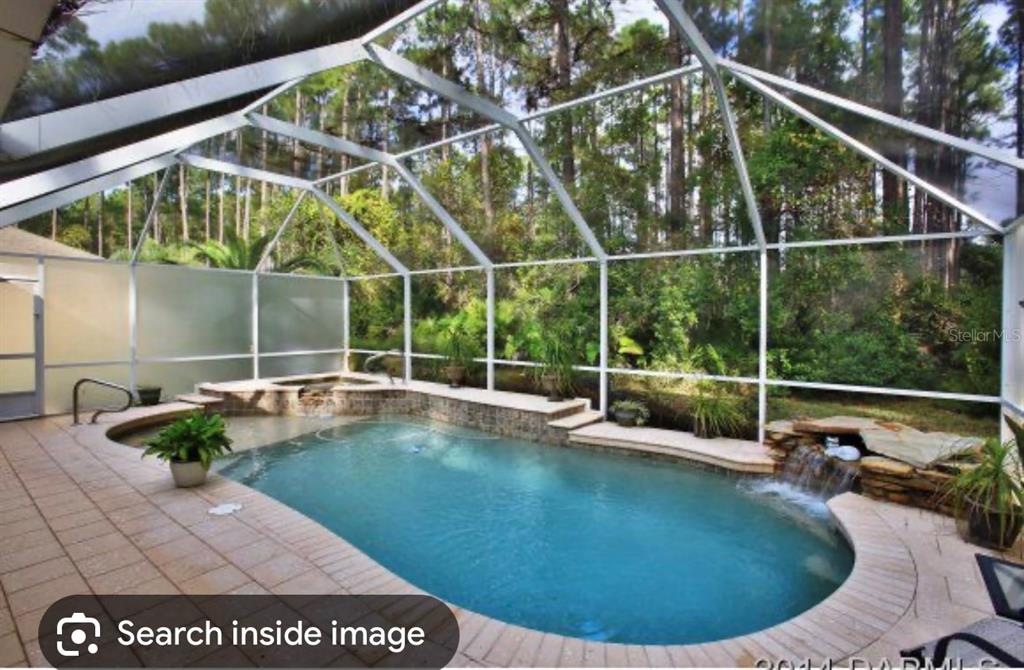 a view of a house with a swimming pool