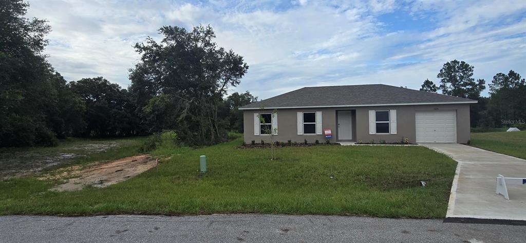 front view of a house with a yard