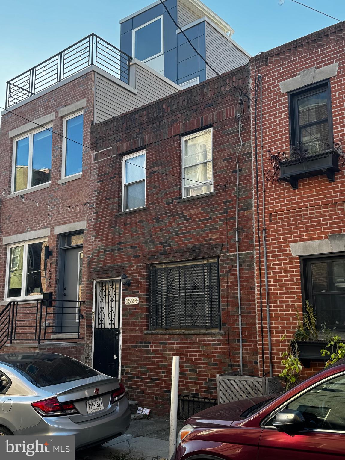 a brick building with four windows